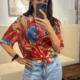 Elegante Seidenbluse mit Blumenmuster & Knotendetail – Rottöne, feminin & stilvoll